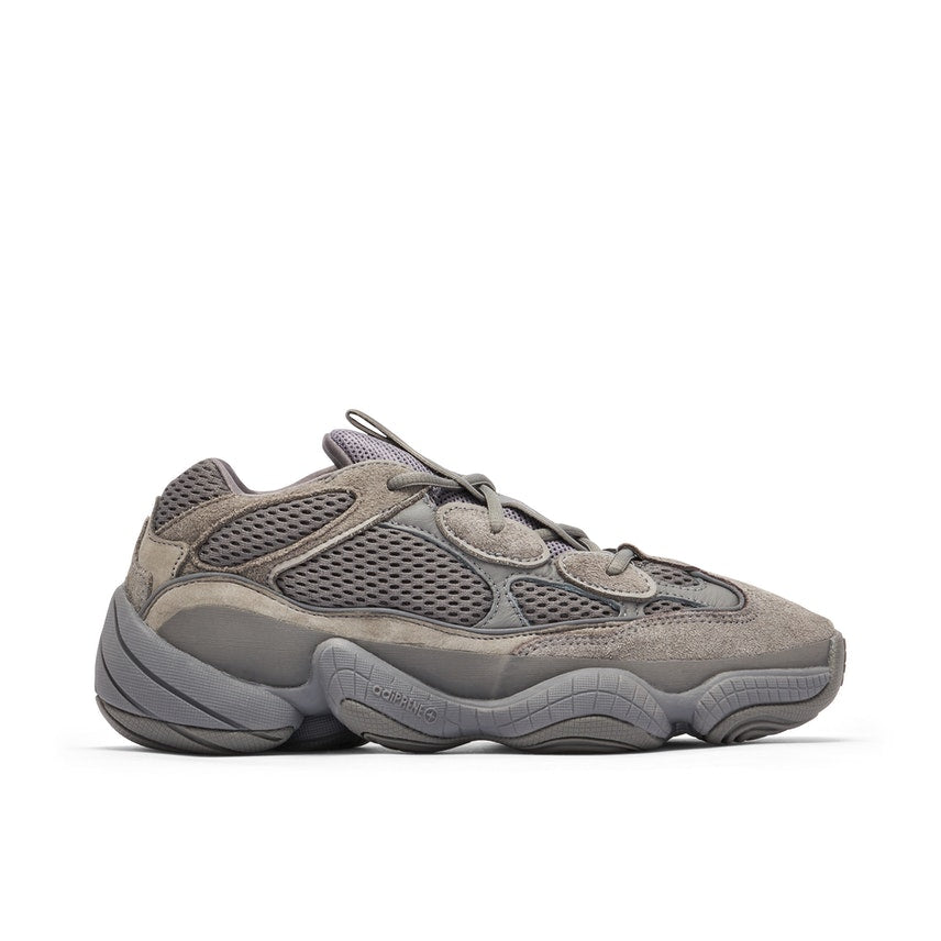 Ash Grey coloured Yeezy Boost 500 sneaker. The shoe contains a bubble shaped sole with a mesh upper and laces